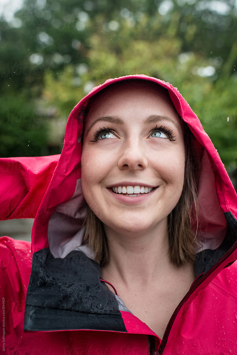 Happy Woman in Pink Raincoat