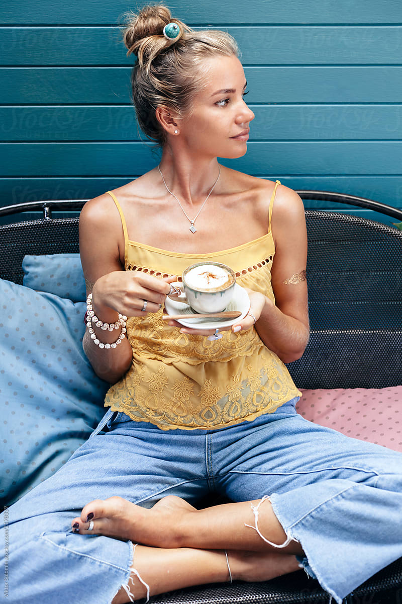 Pretty woman chilling alone with coffee