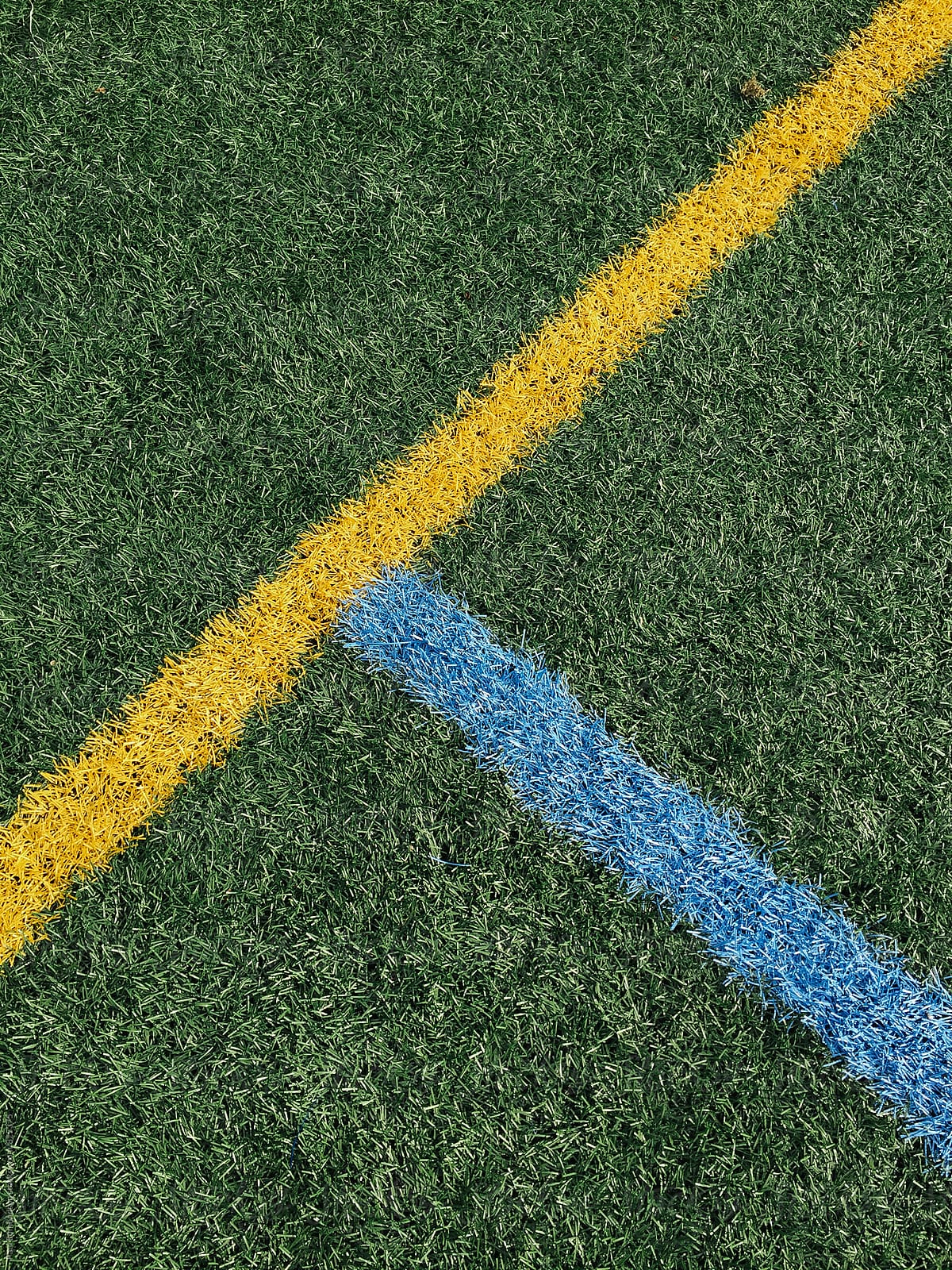 Colorful boundary lines on artificial turf sports field