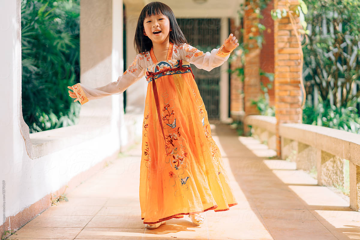 Chinese little girl play in traditional garden