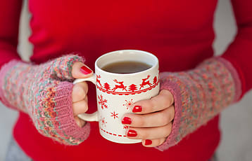 Young Woman Holding A Cup Of Tea | Stocksy United