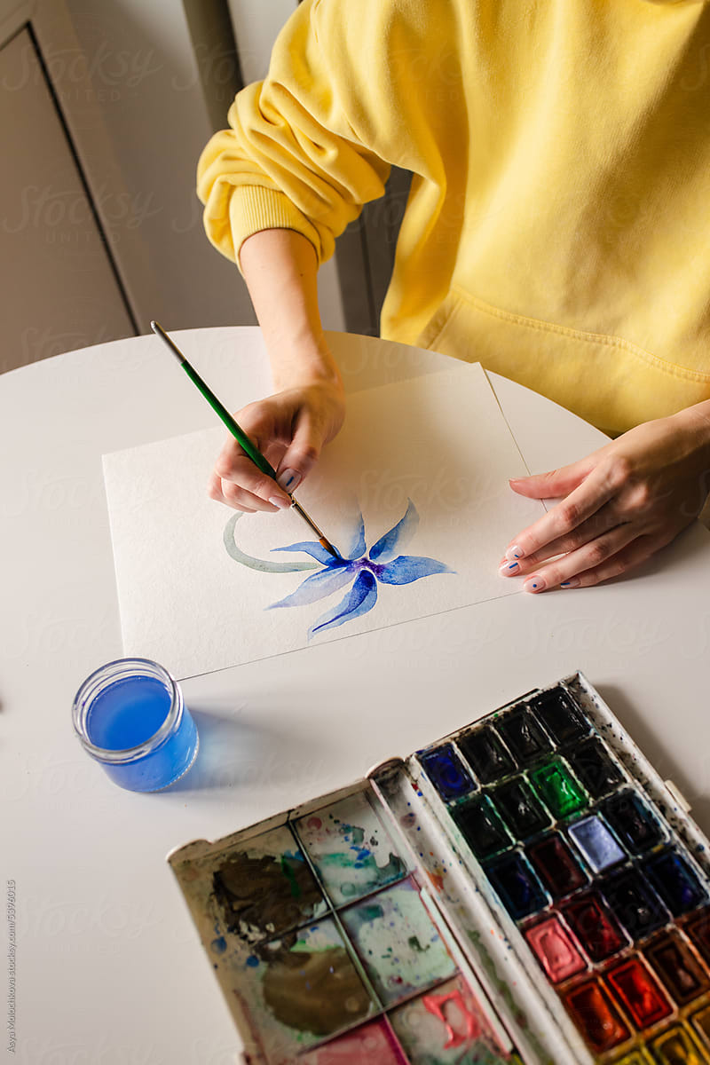 Woman is painting an illustration