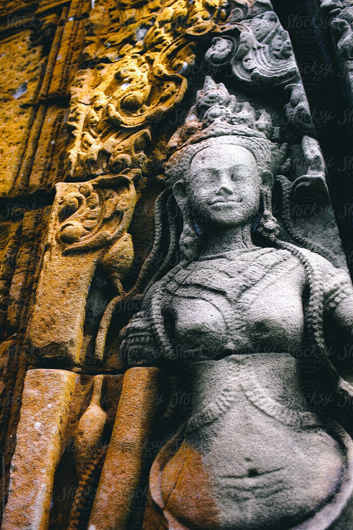 Asian woman sculpture carved on rock in Angkor Wat temple, Cambodia