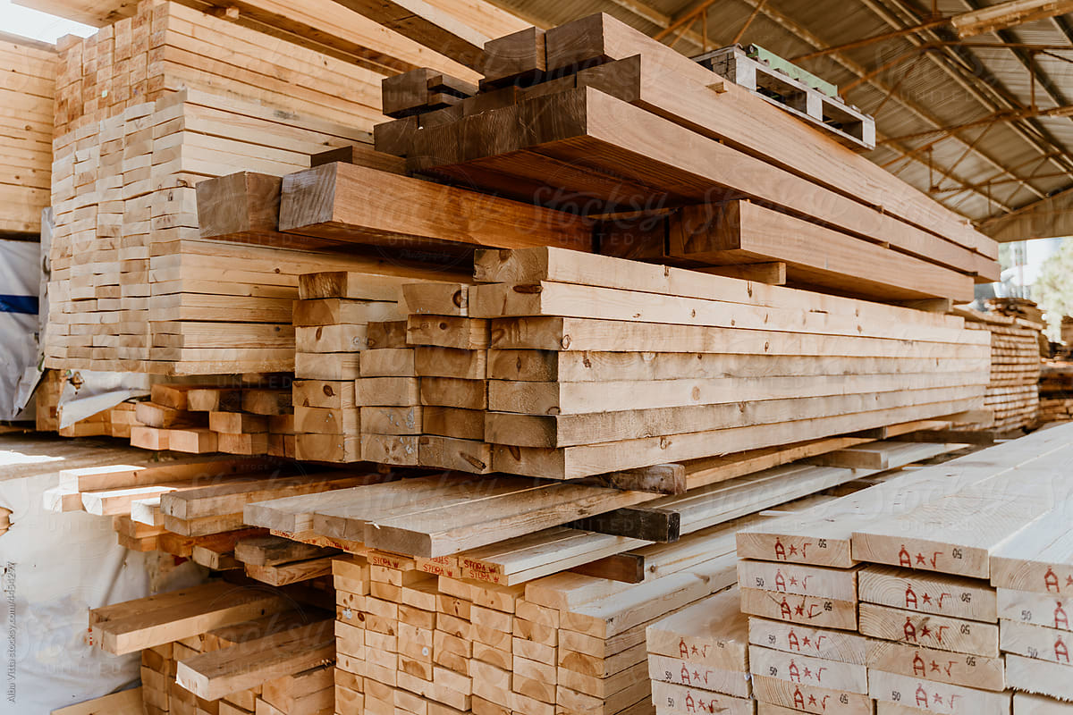 Pile of Wooden boards at lumber mill in a barn