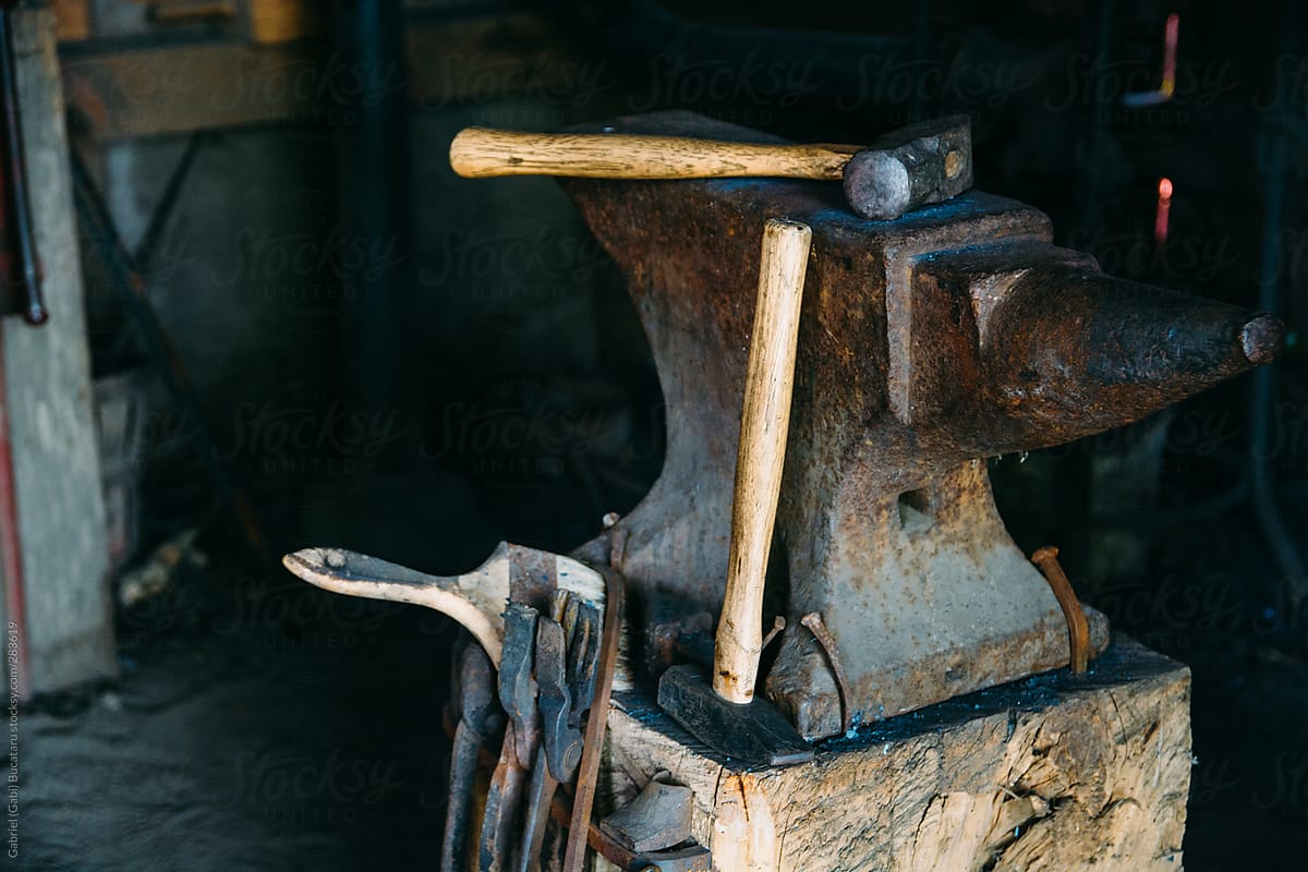 Old Hammer And Anvil in a Blacksmith Shop
