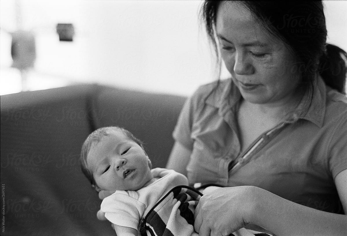 Chinese Grandmother Holds Newborn Daughter