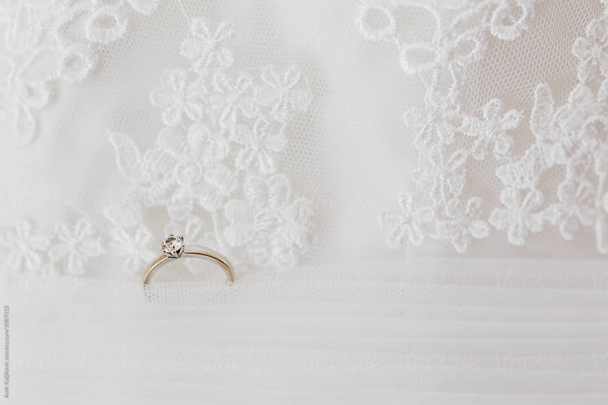 Wedding or engagement ring on a lacy veil