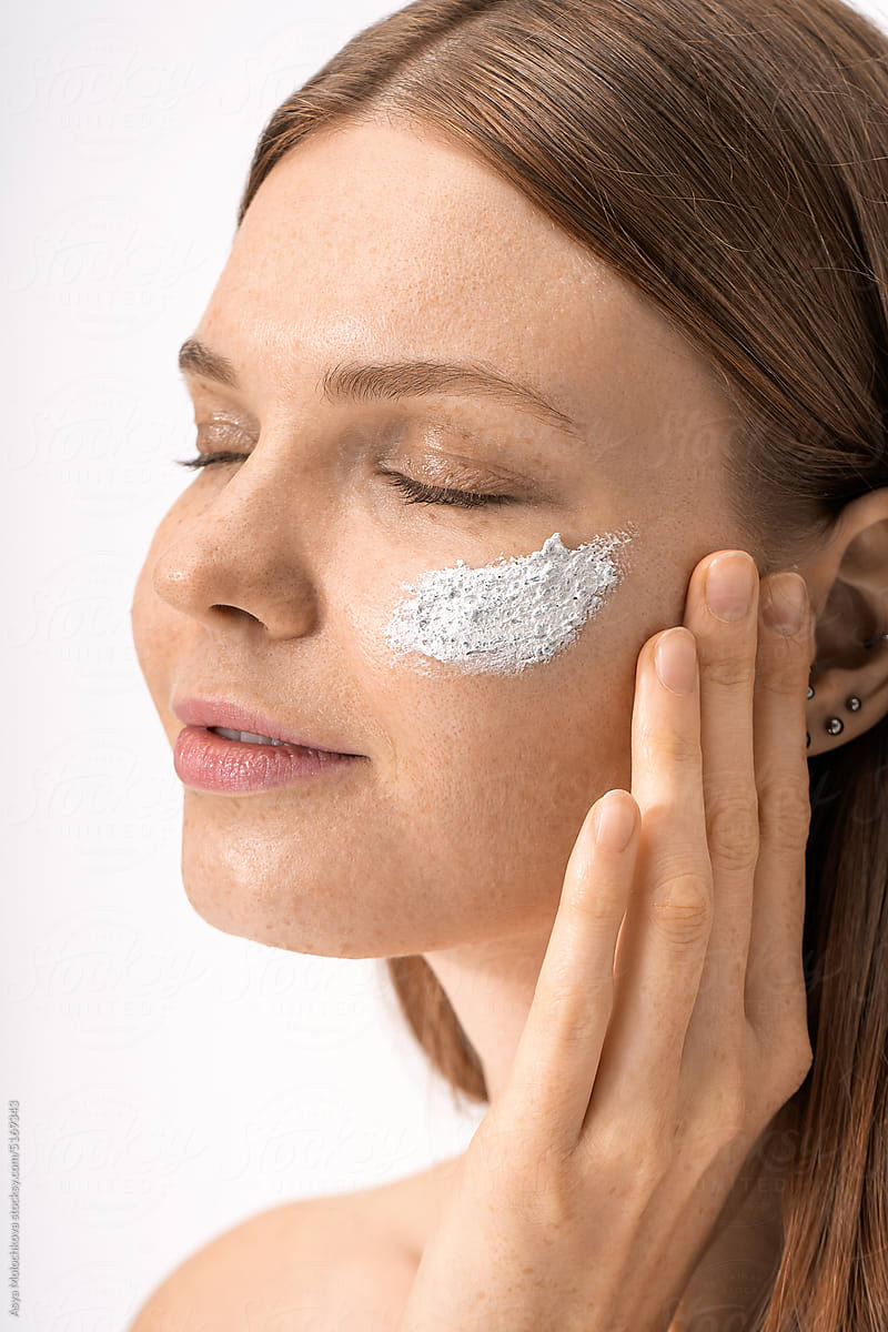 Applying beauty mask on face