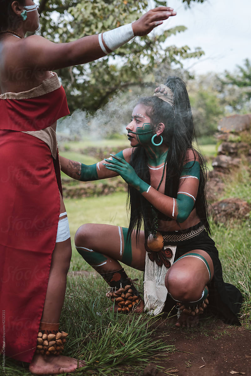 Indigenous woman performing smoke ritual