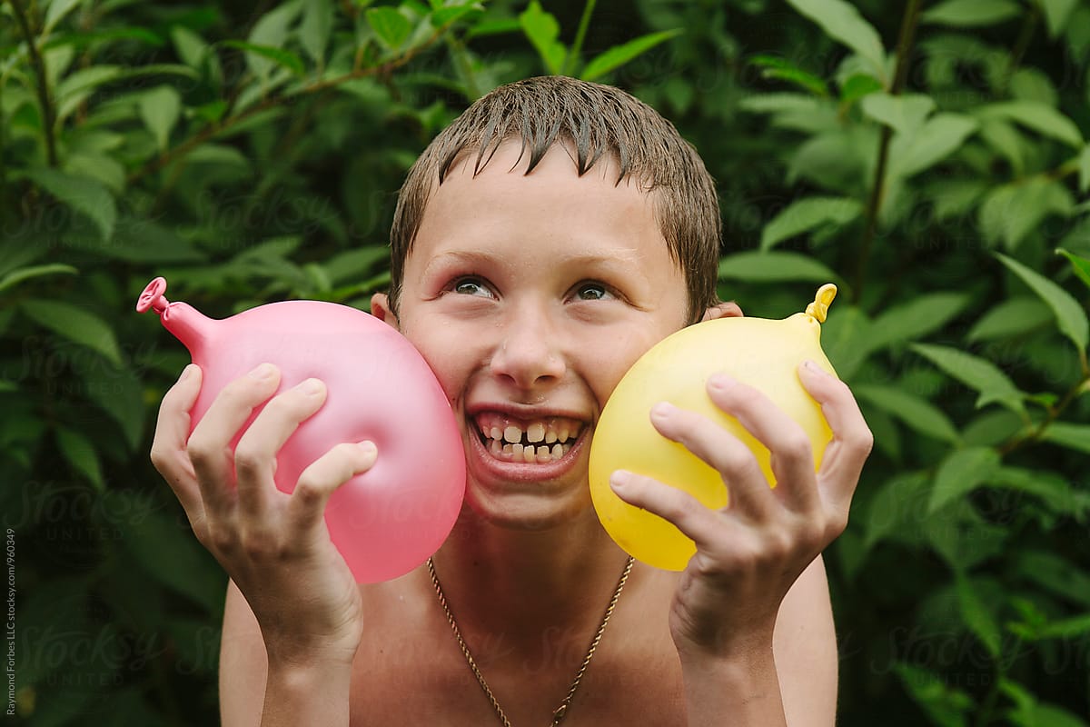 Happy Child With Water Balloons
