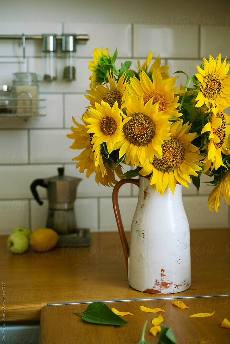 Bouquet of sunflowers in a vase in the stylish kitchen