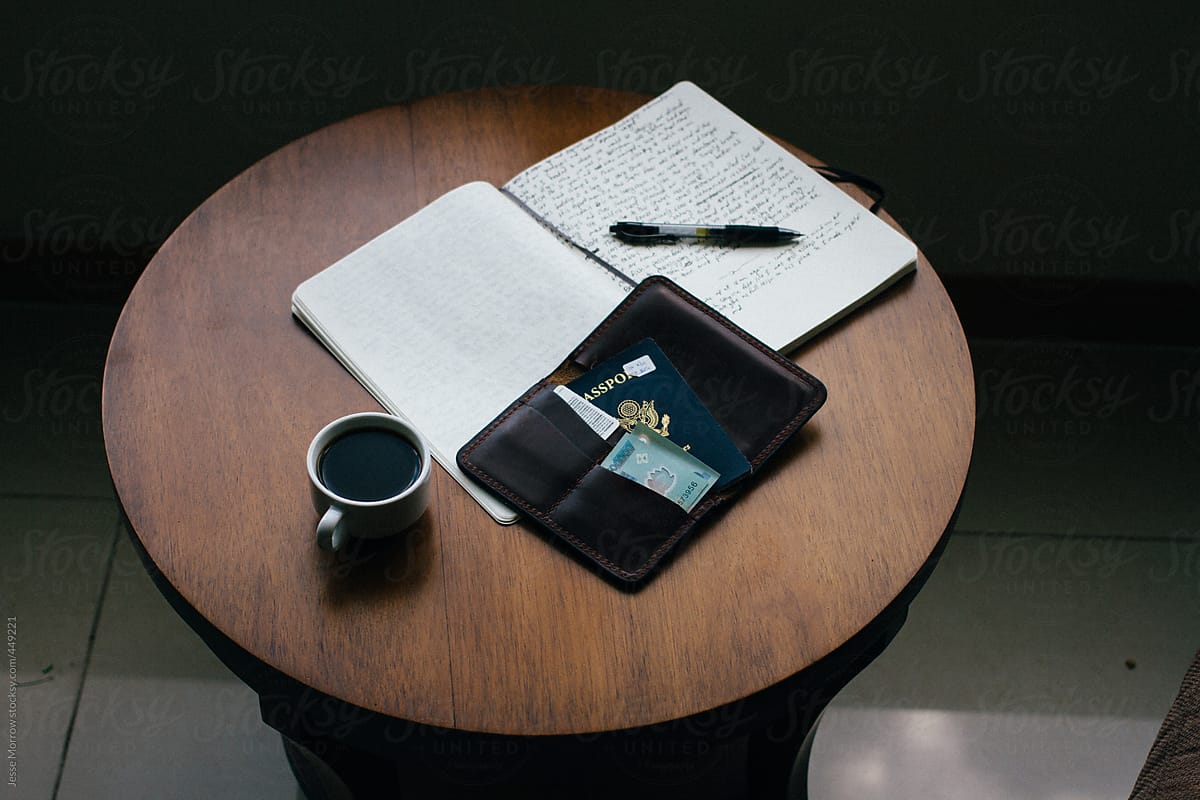 Notebook and passport on a table