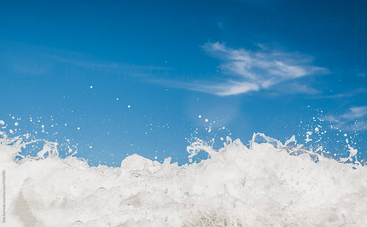 Dreamlike sea wave foam texture with blue sky
