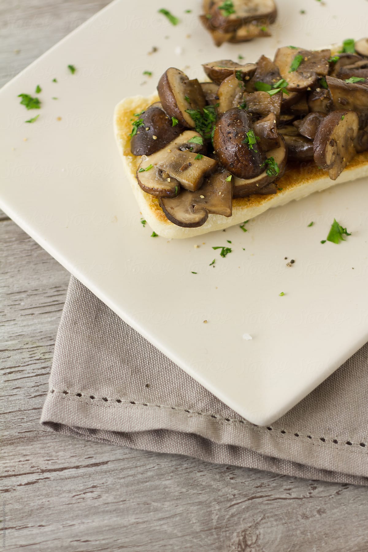 Garlic mushroom bruschetta on plate with copy space