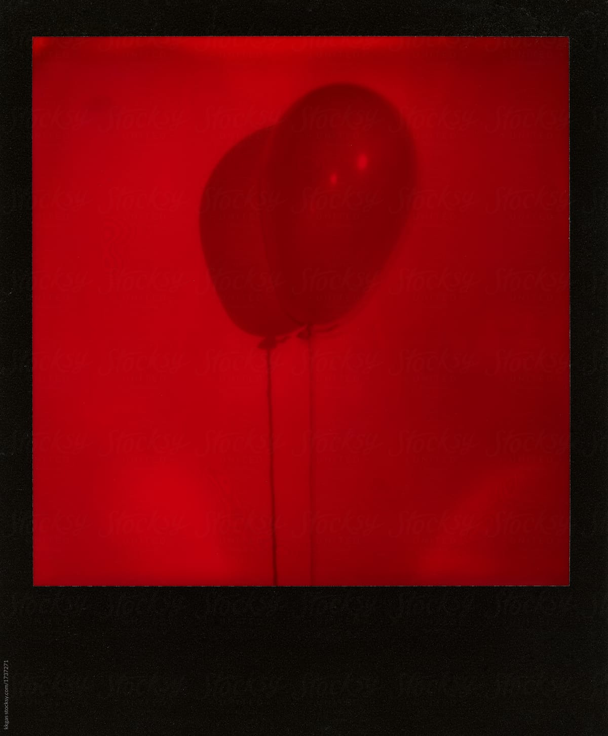 Red polaroid scan of a balloon