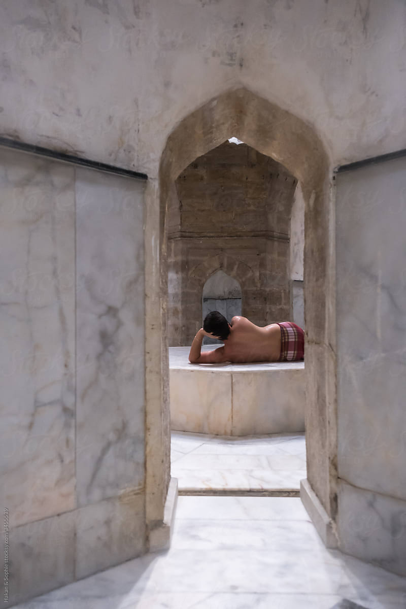man lying on the warm stone  in a hamam