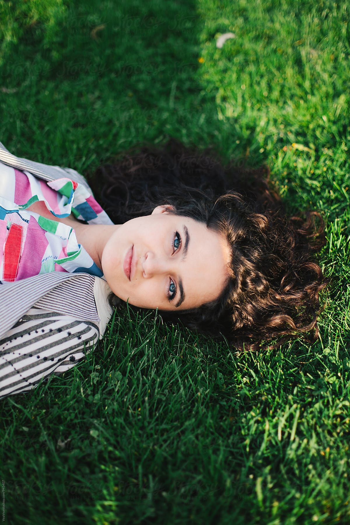 Beautiful Woman Lying On Grass By Stocksy Contributor Mak Stocksy