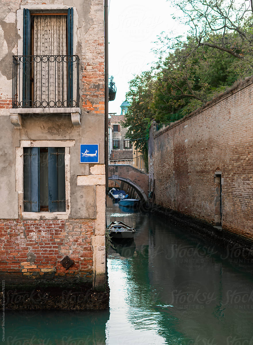 Boat sign on the house above water canals in Venice