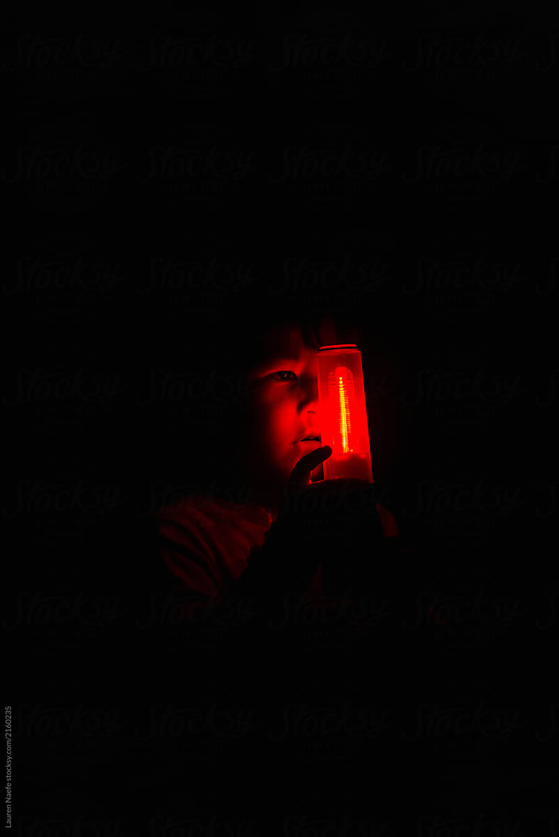 Kid with red flashlight