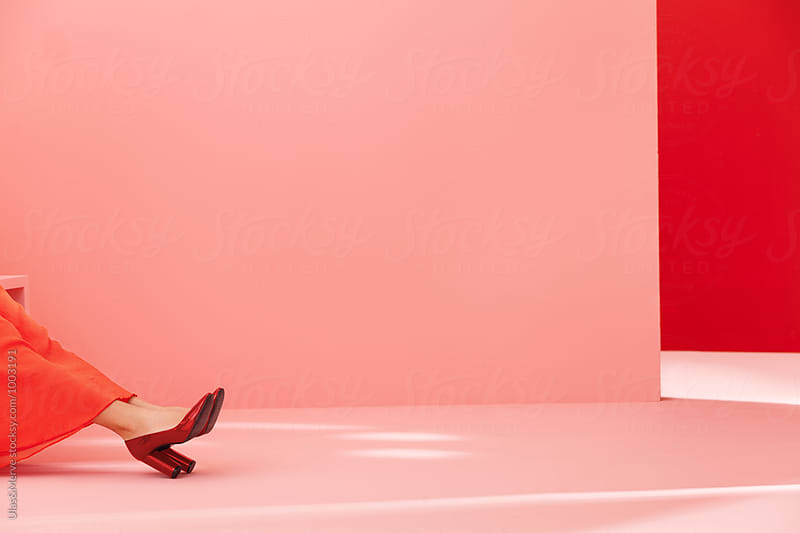 conceptual image with high heels and red and pink walls
