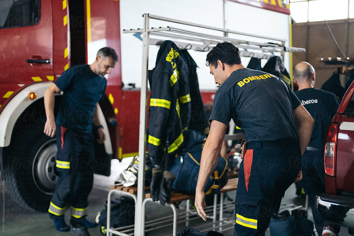 firefighters putting on the uniform to go to an emergency
