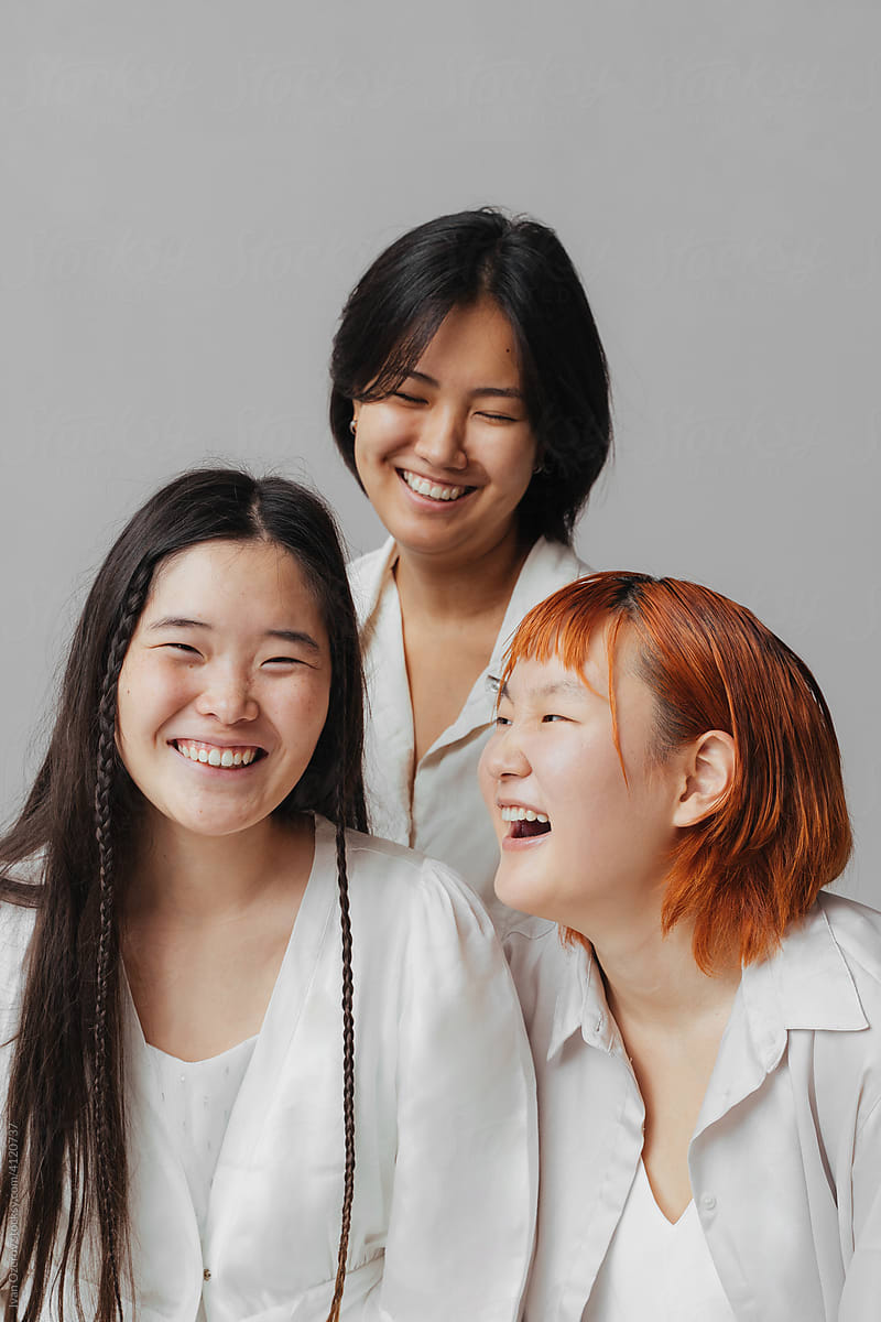 young cheerful asian women laughing