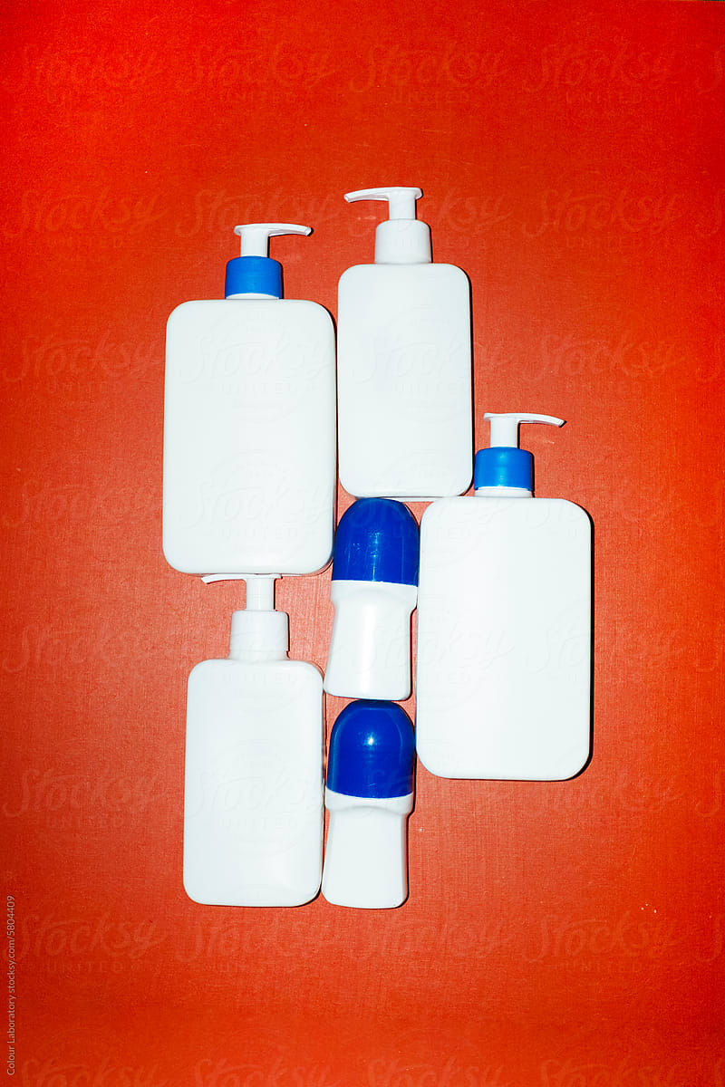 White plastic cosmetics lotion bottles with hard direct flashlight