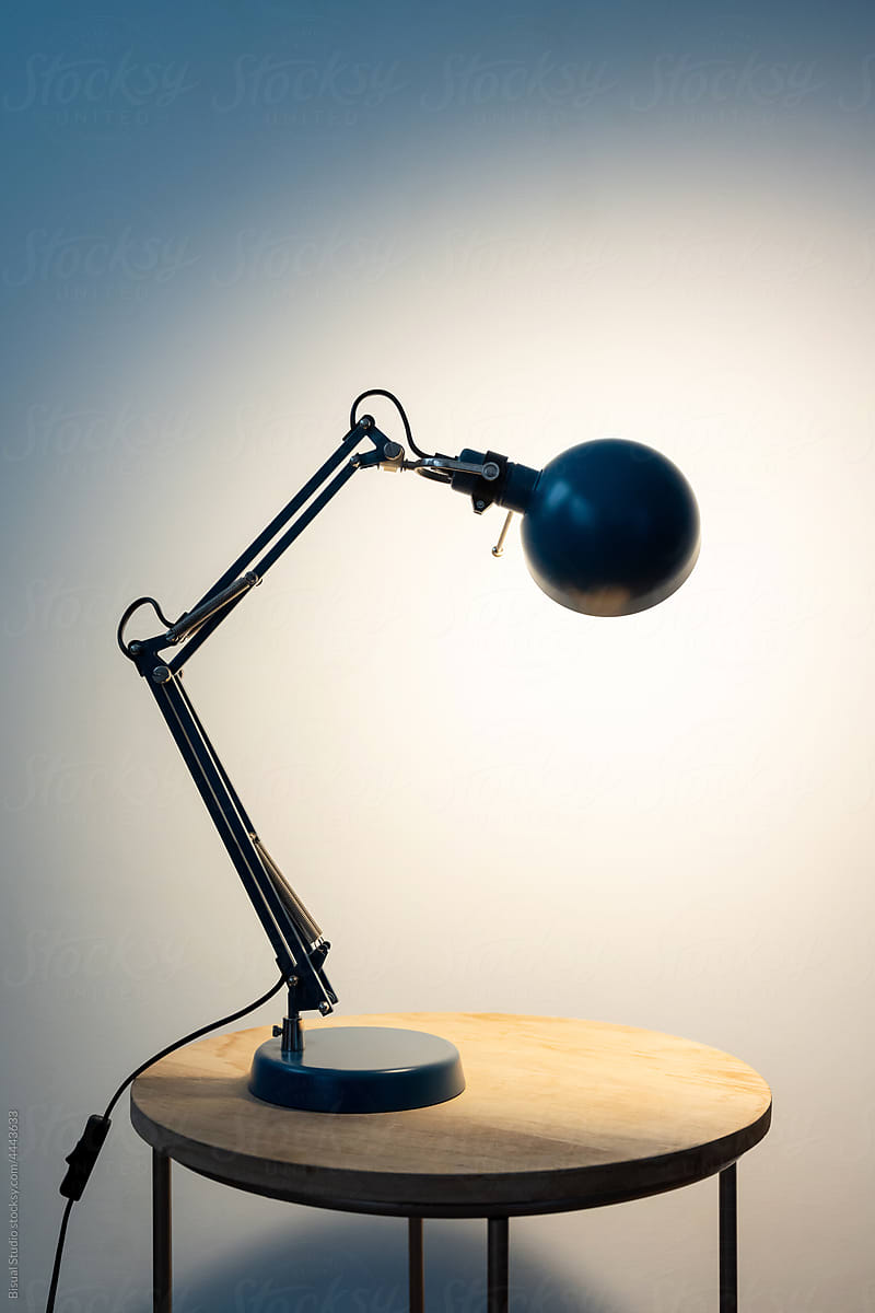 Vintage desk lamp on wooden table
