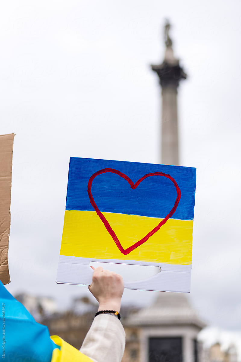 Woman with a Ukraine flag in a  protest
