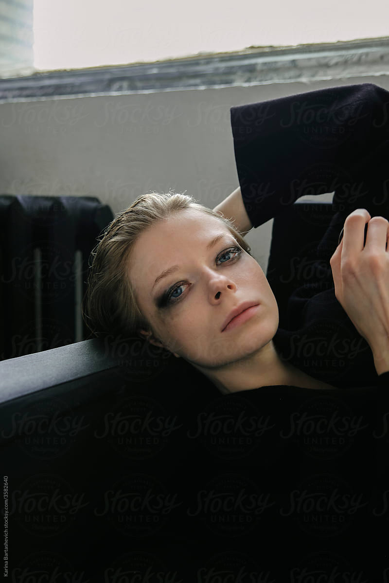 portrait of a girl lying on the couch