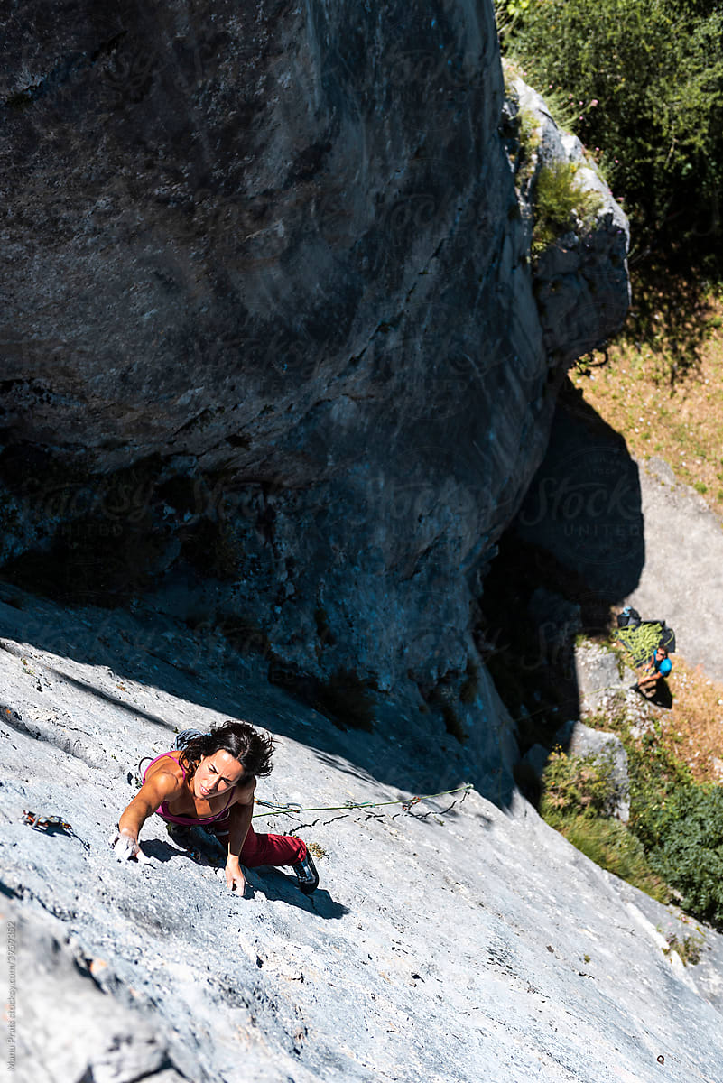 Woman climber rock climbing