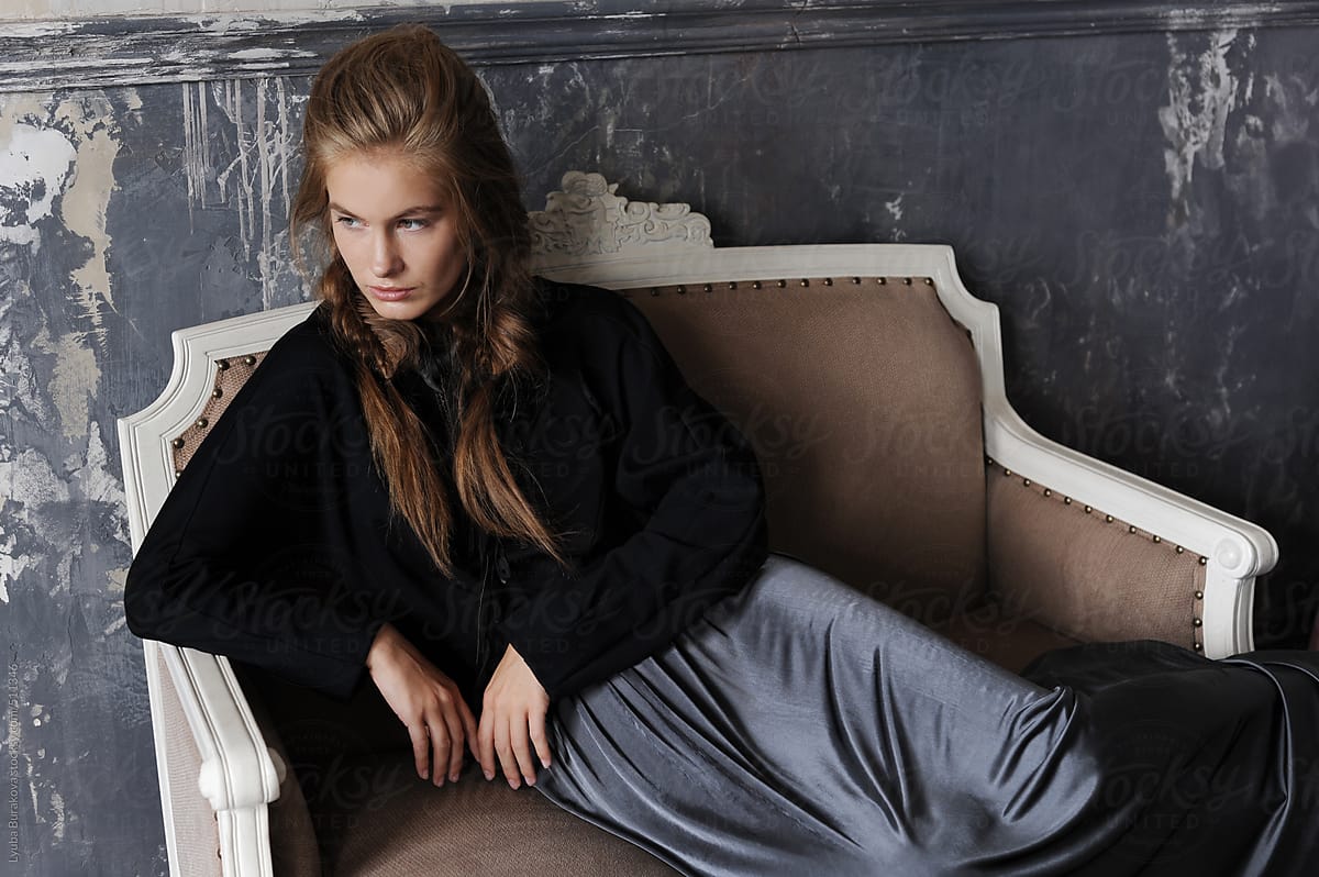 Fashion Shot Of The Young Woman Sitting On The Sofa By Stocksy Contributor Amor Burakova 0555