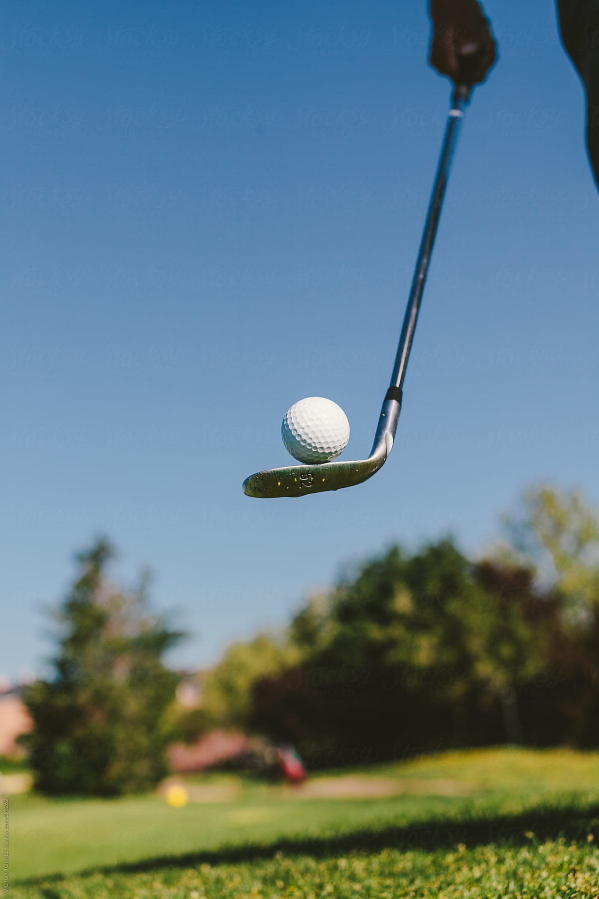 Golfer Balancing with a Ball