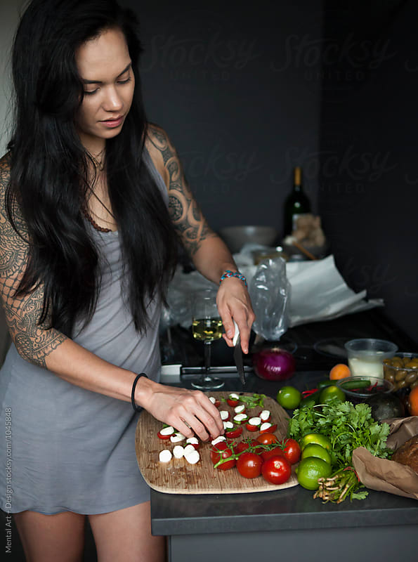 Pretty, fit, woman cooking.