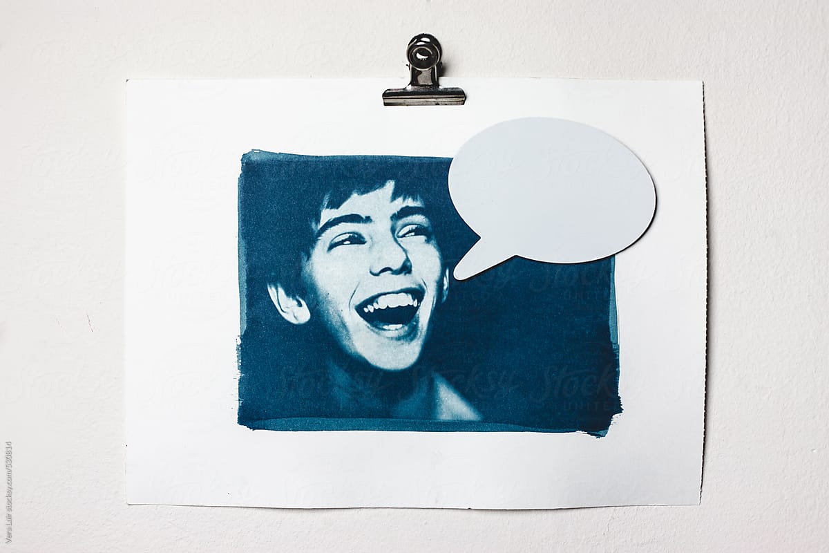 A cyanotype with a young boy laughing, and a dialogue bubble