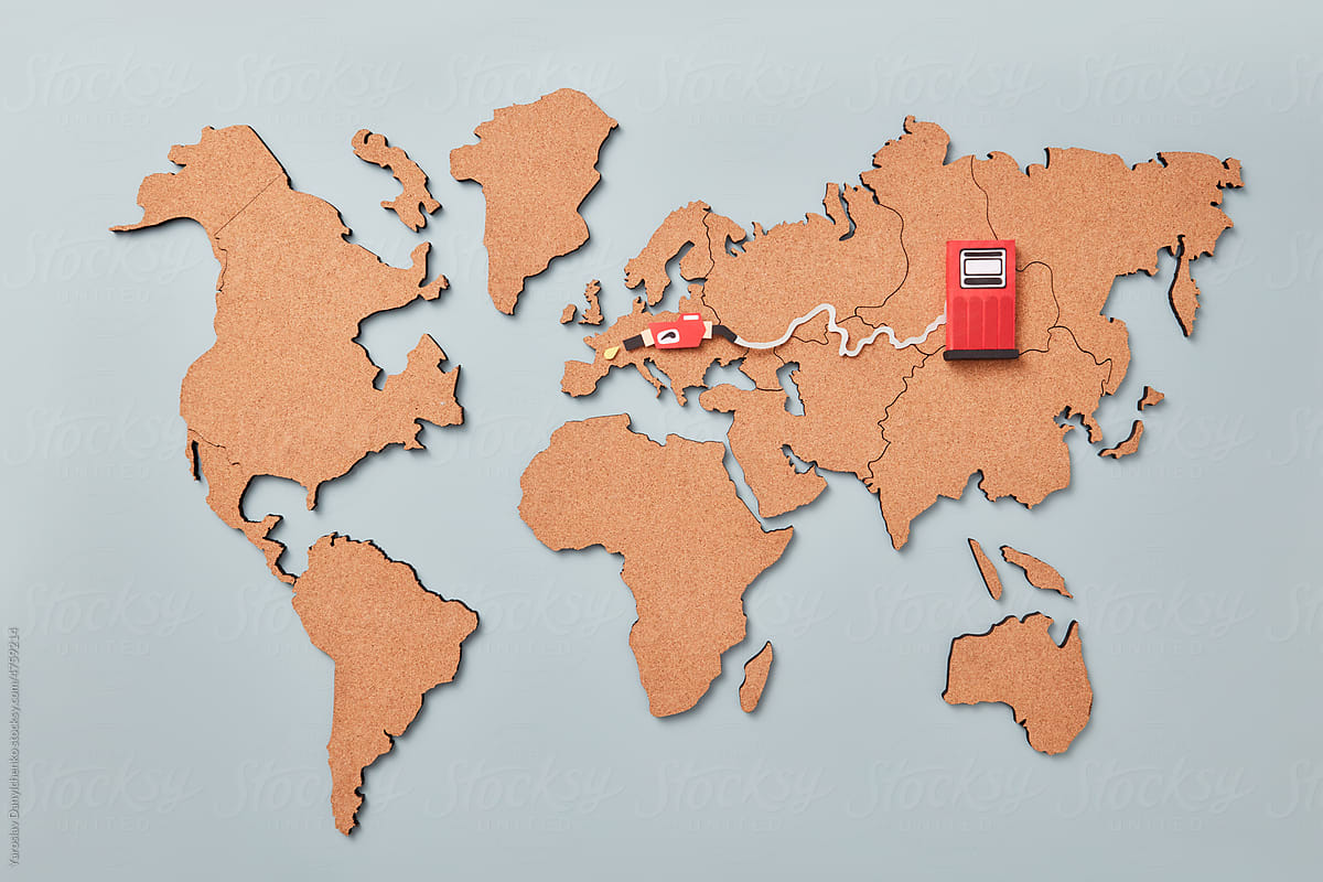 World map with paper petrol pump.
