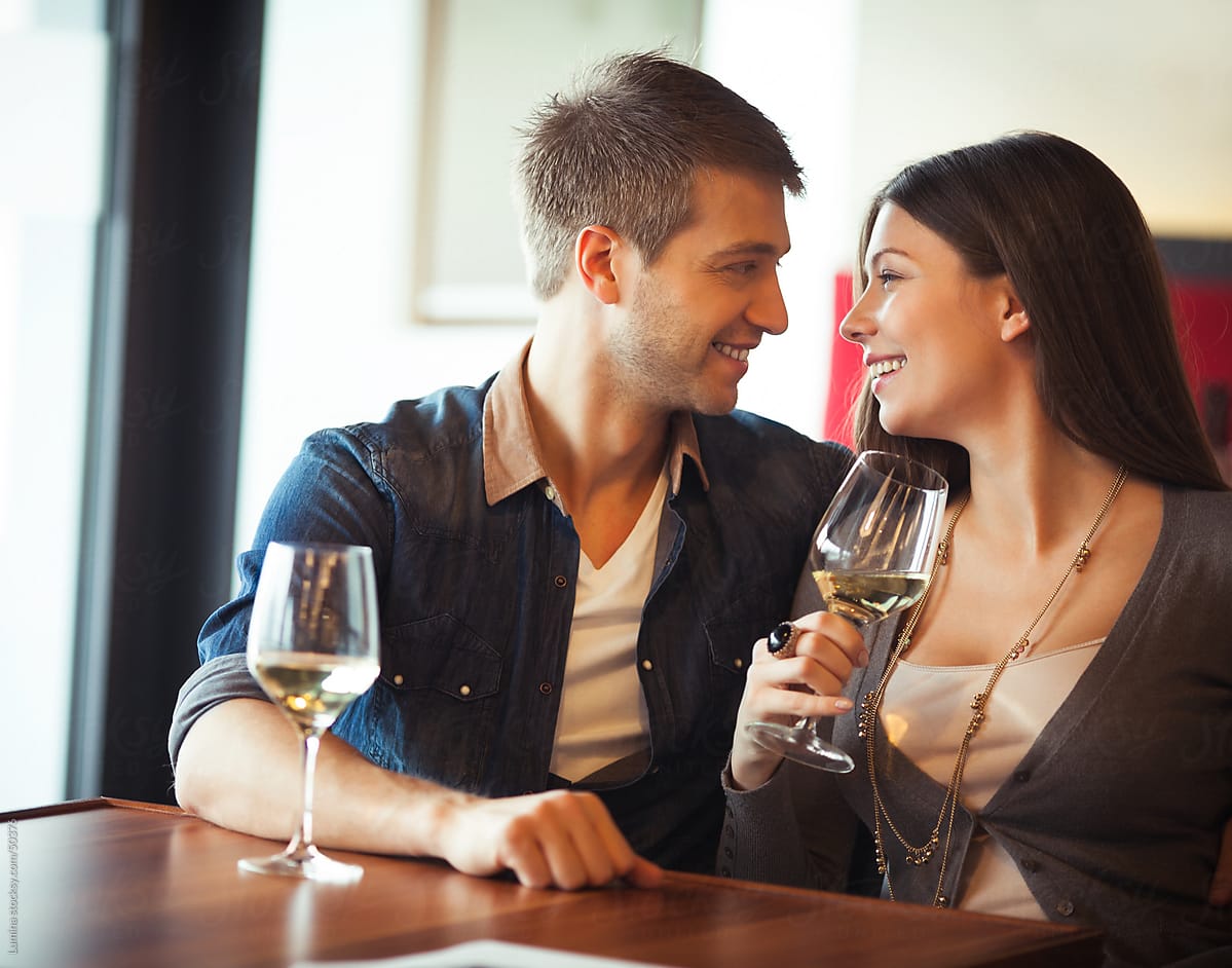 Couple Drinking Wine At A Restaurant by Lumina