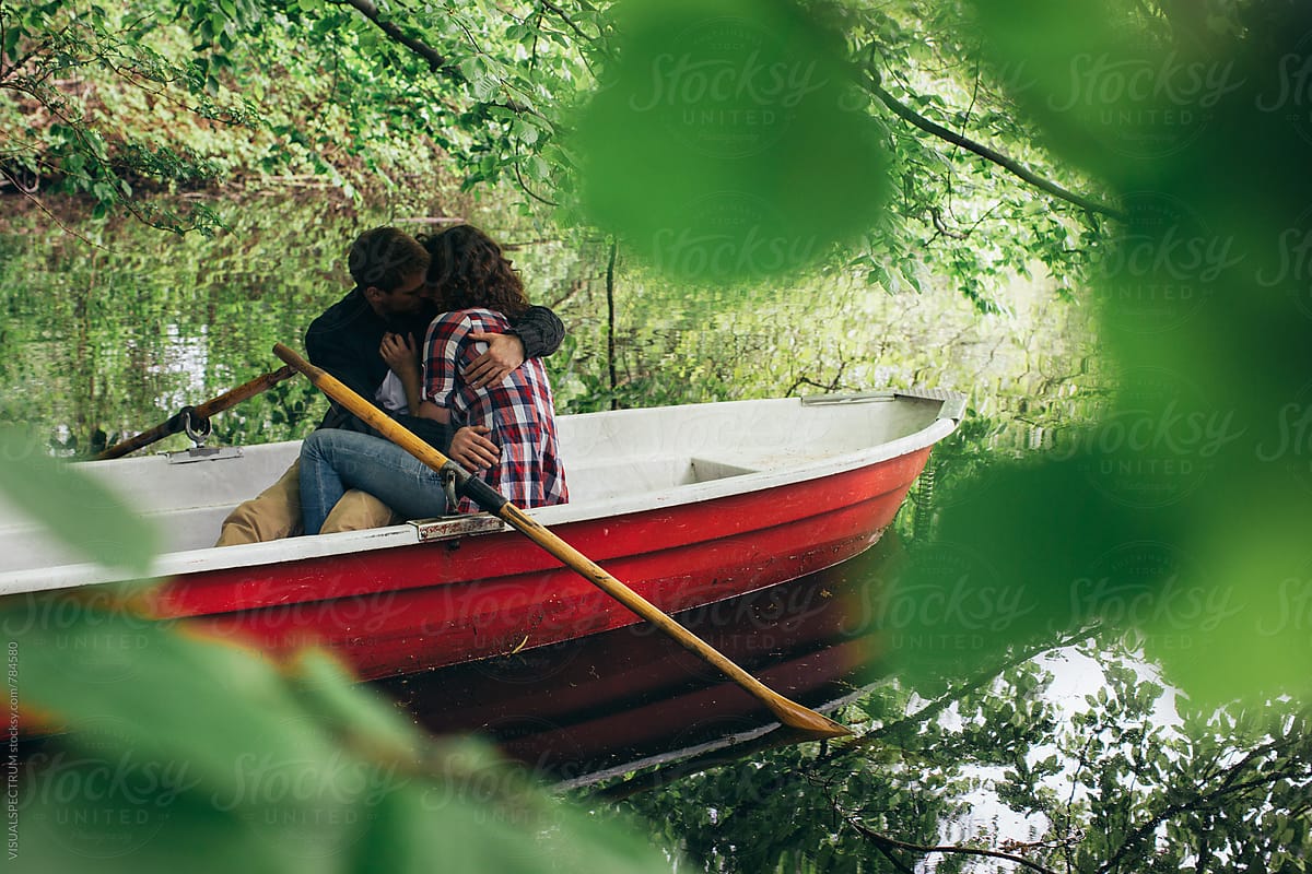 Romance - Heterosexual Couple Making Out on Rowboat