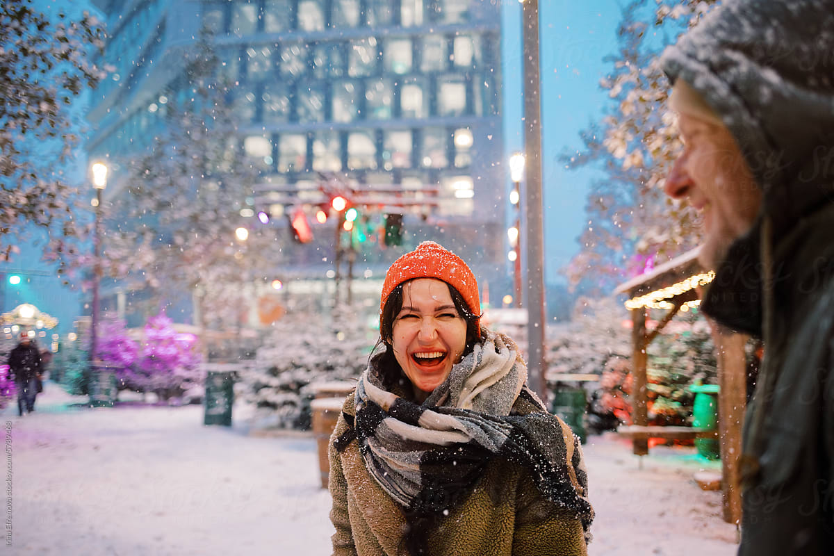 Blizzard Date: Couple\'s Laughter Echoes in the Business District
