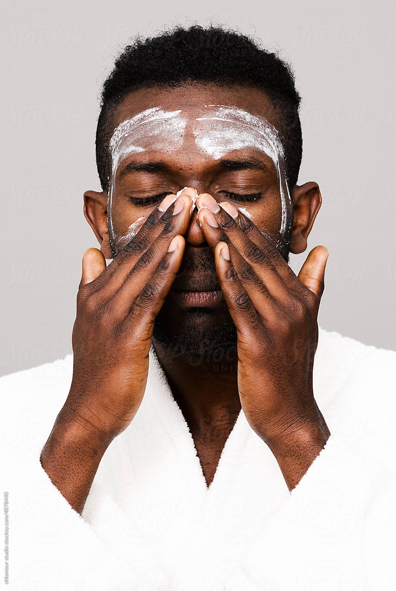 Man using face wash