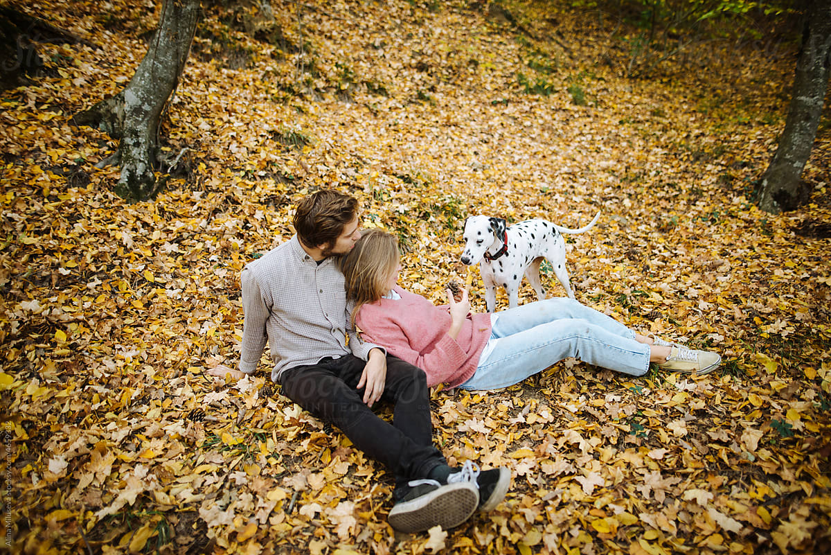 Couple with dog in fall season