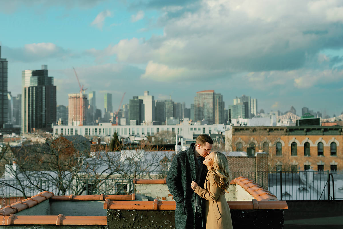 Couple Embracing on a Brooklyn Rooftop