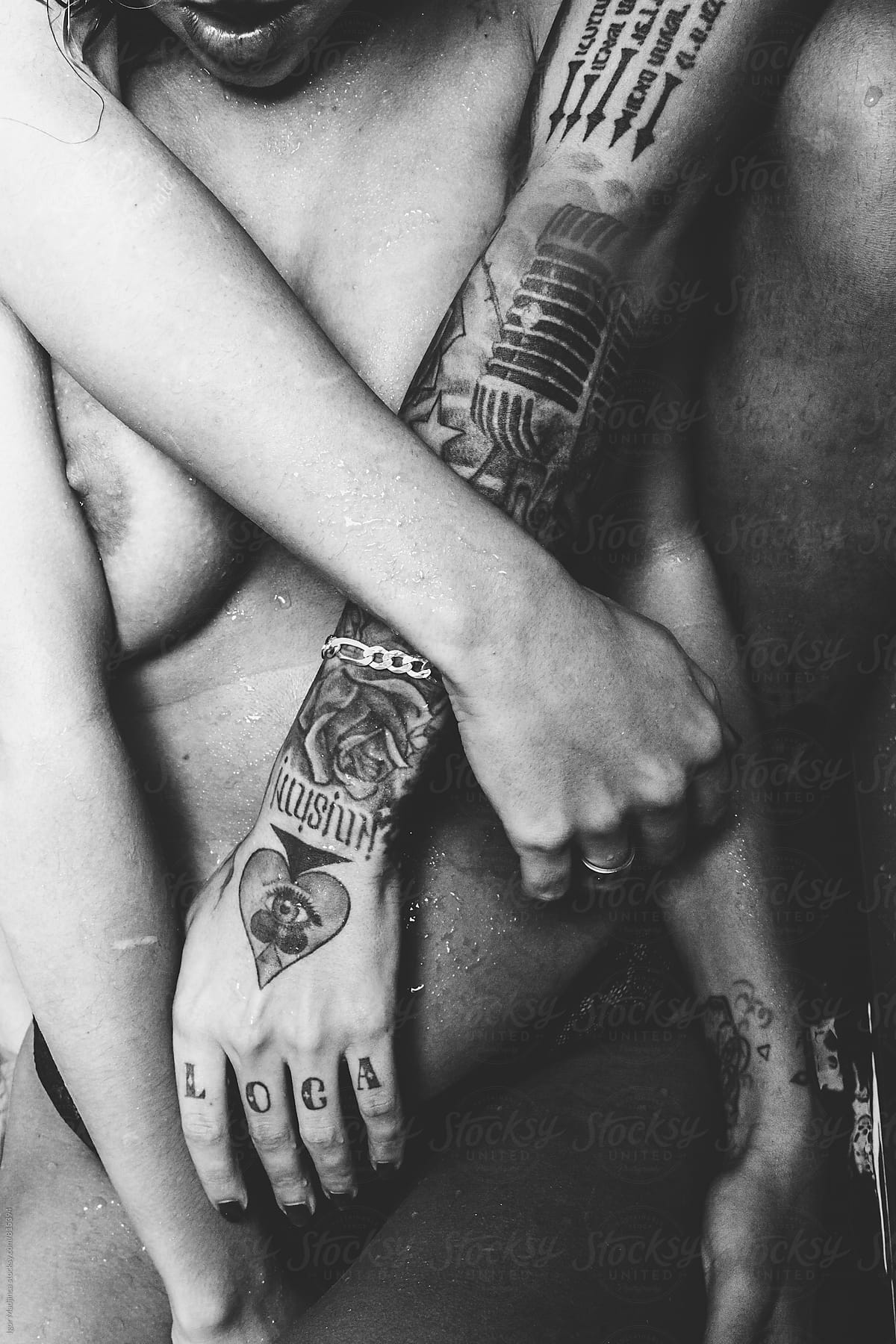 detail, two naked tattooed girls in a tub
