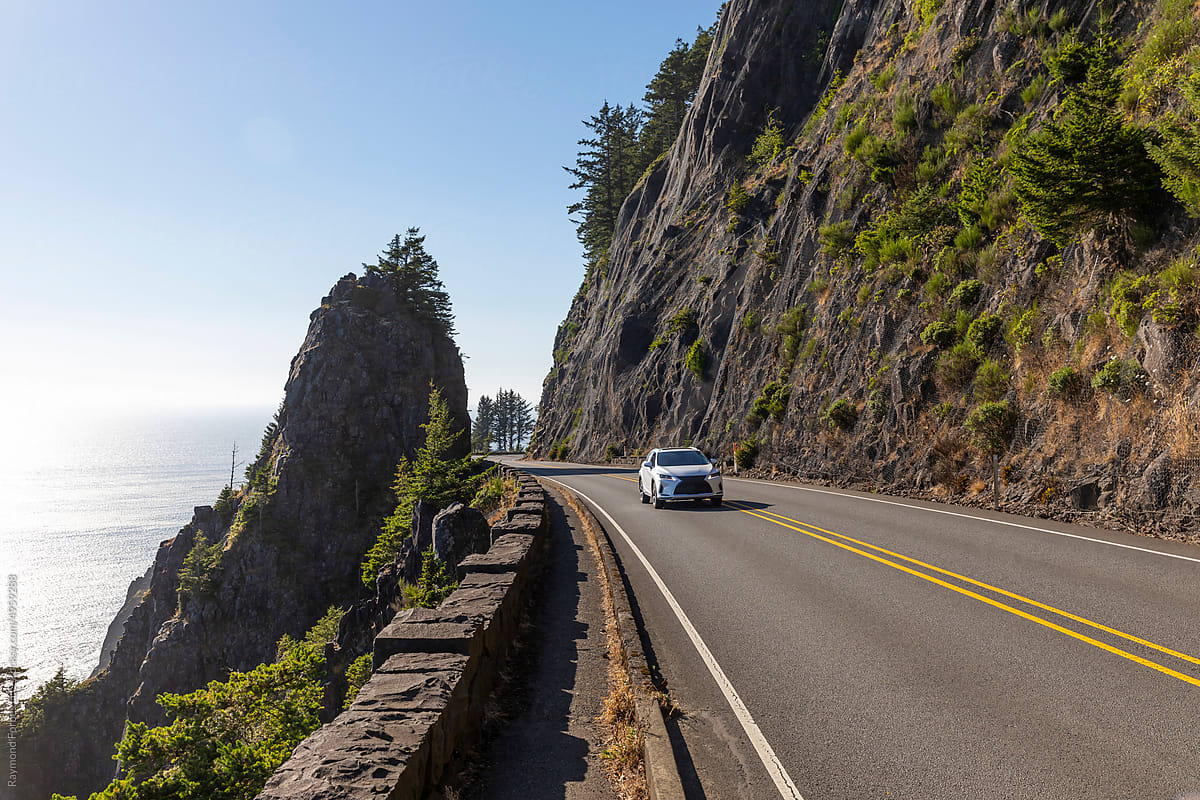 Road trip car  Rugged Oregon Coast landscape with rock formation