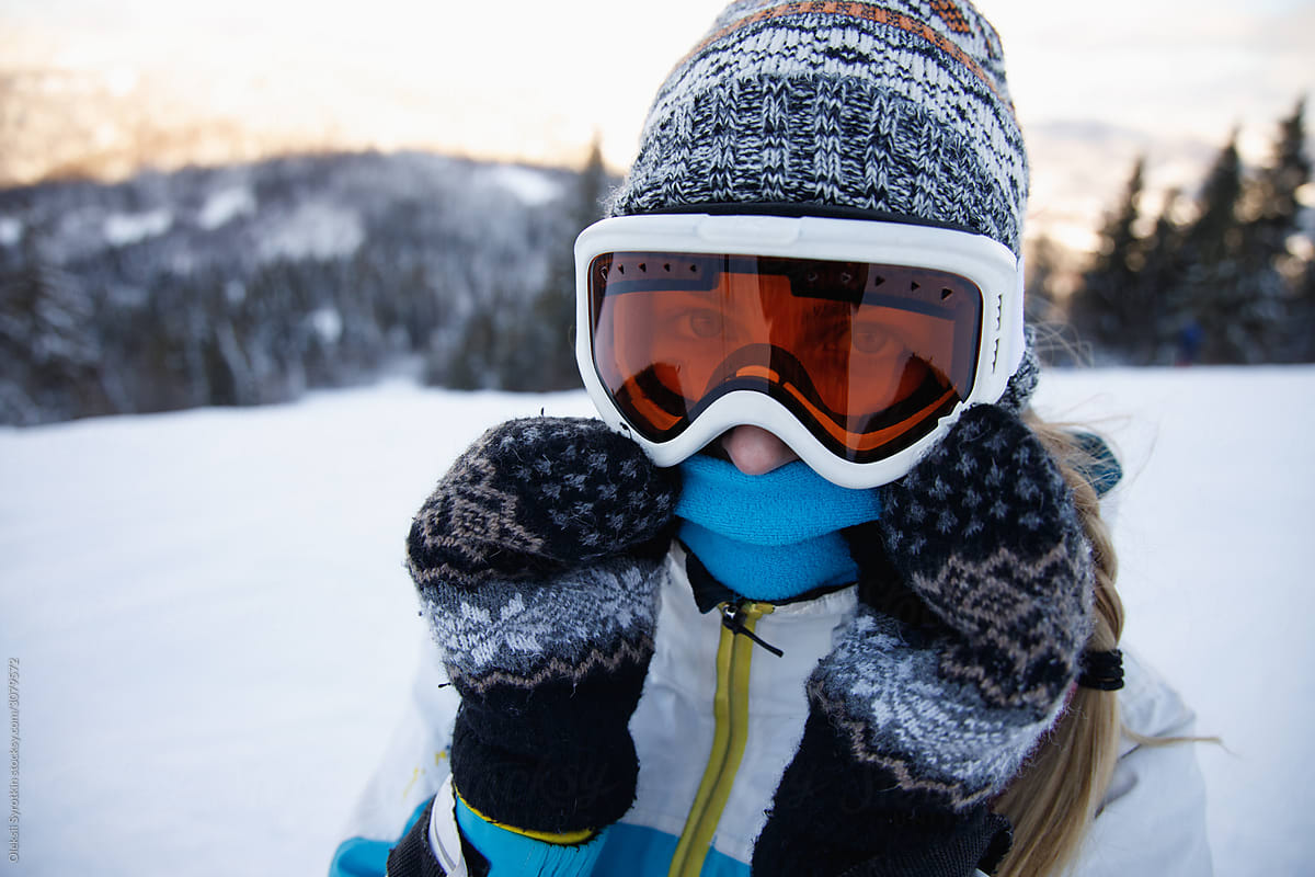 Woman in ski suit enjoying her vacation .