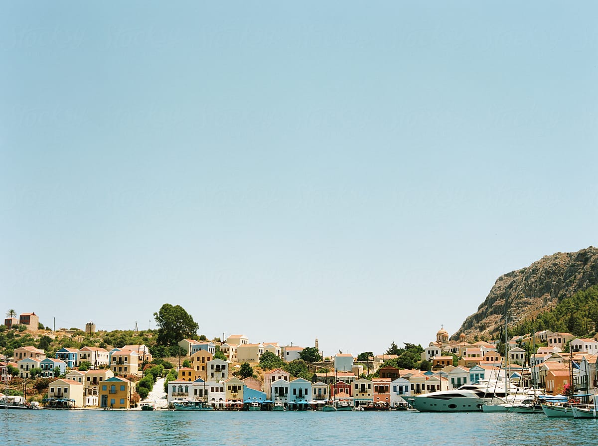 View of harbour the many coloured houses in the bay at Kastellorizo