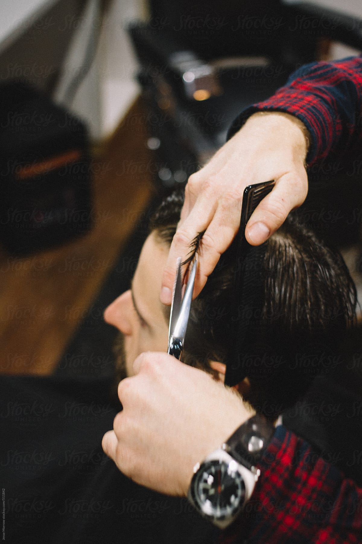 "Barber Cuts Young Male Hair" by Stocksy Contributor "Jesse Morrow