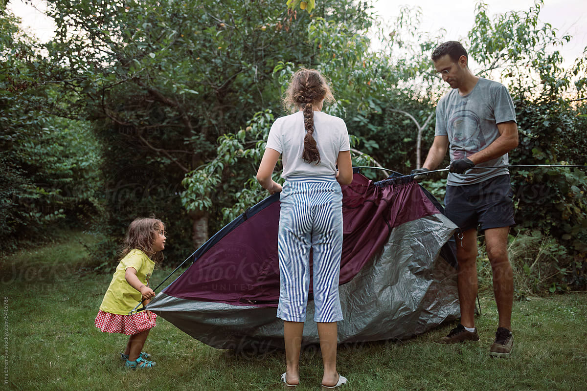 Twilight Tent Setup: Dad and Daughters at Home Garden