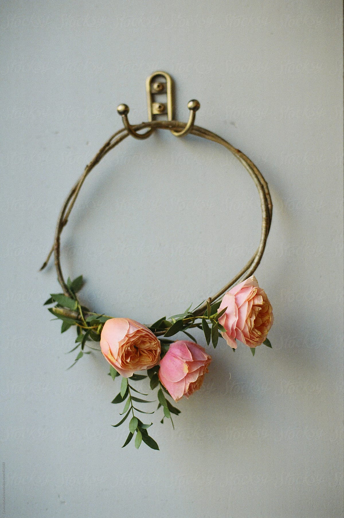 The bride\'s diadem of roses in rustic style  on the wall hook
