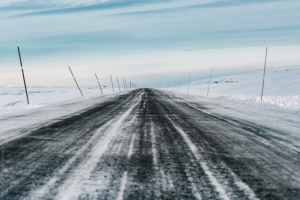 Driving Scandinavia - Straight Road Through White Winter Landscape